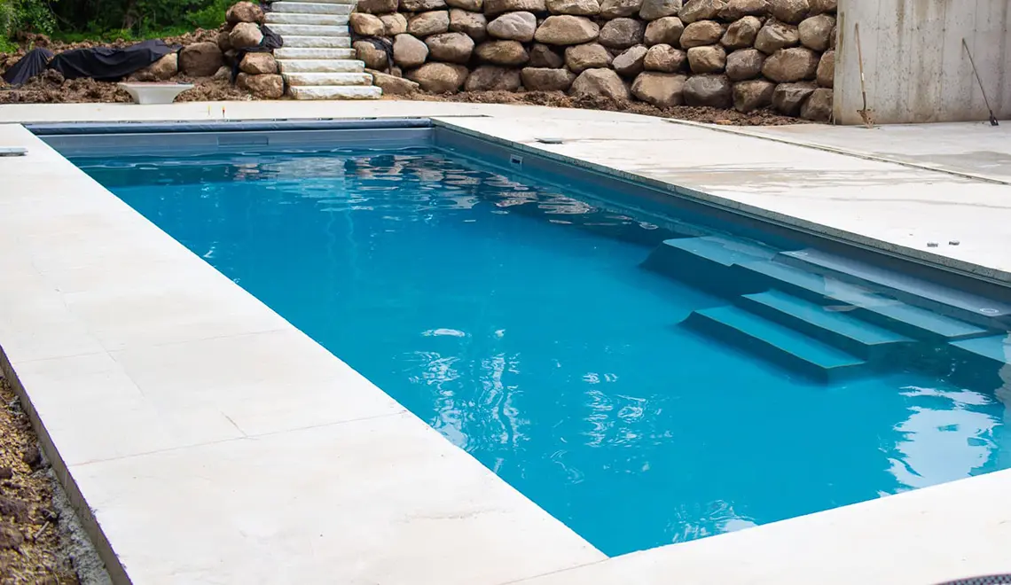 Leisure Pools The Grand rectangular fiberglass pool side view by Leisure Pools Savannah